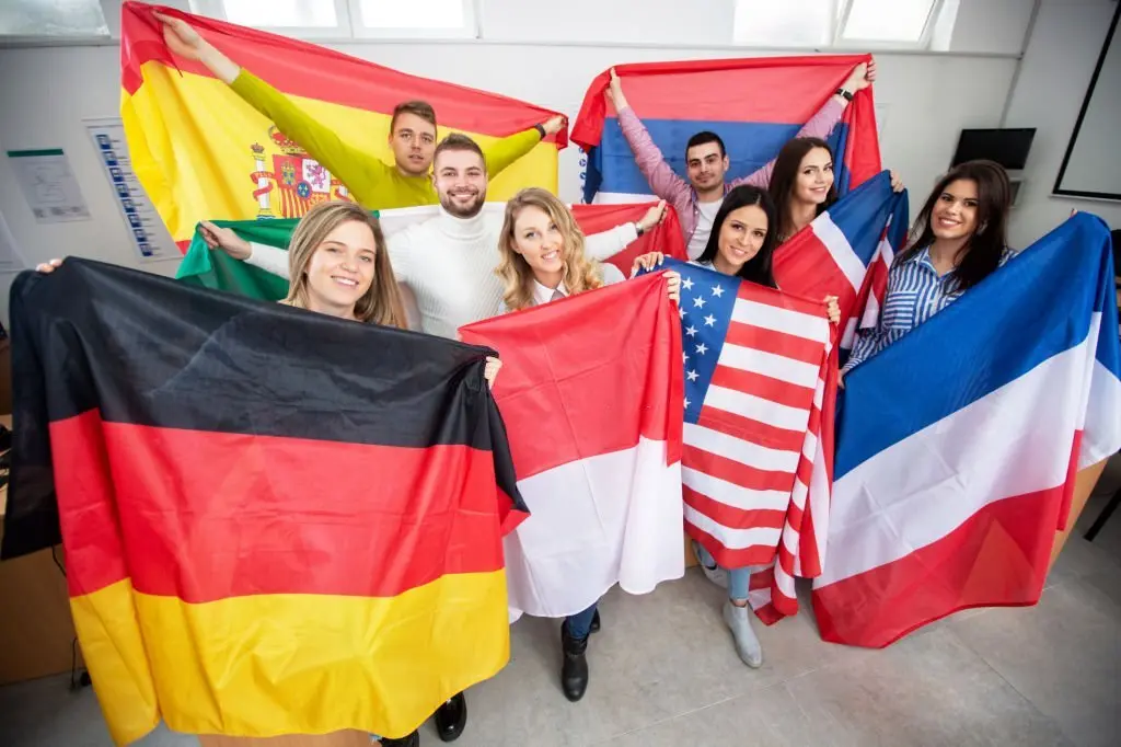 student holding flags of various contries